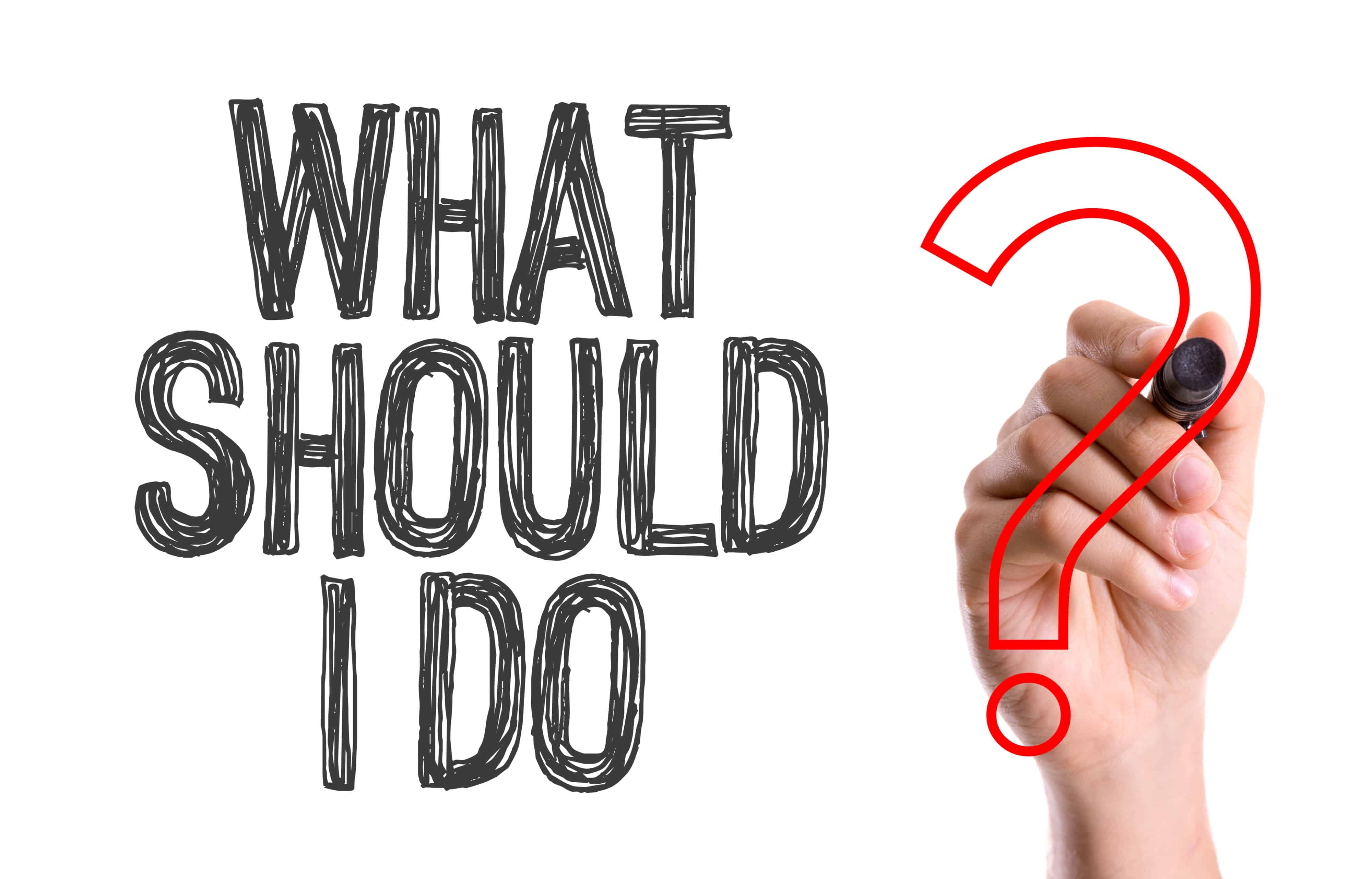Hand with marker writing: What Should I Do?
