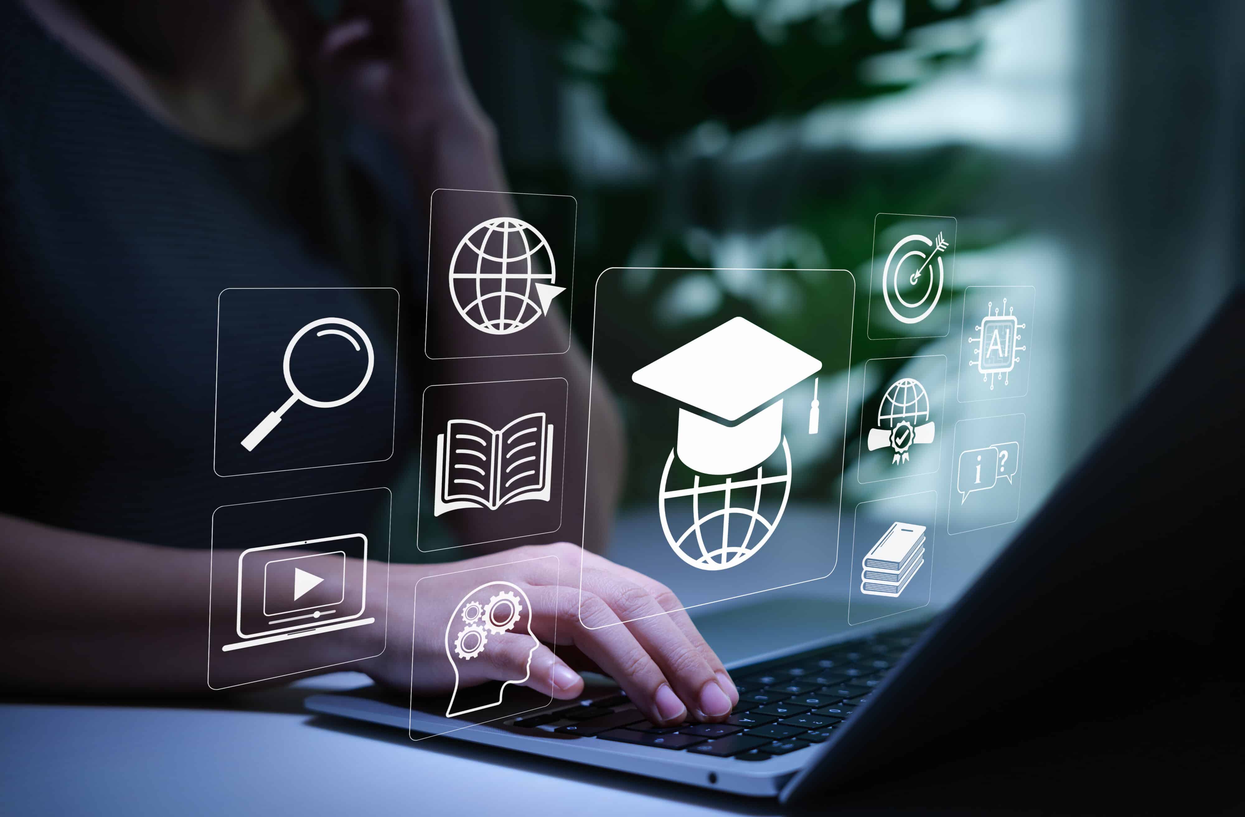 Online Education and E Learning Technology Concept. Person using laptop for online education with learning tools icons, graduation cap, AI, books, global connectivity, study platform, learn virtual,